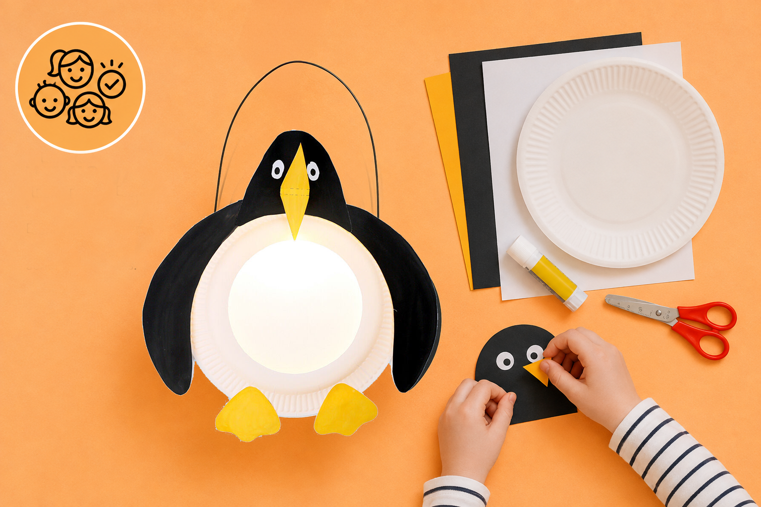 Ein Kind bastelt eine Pinguin-Laterne mit Papptellern