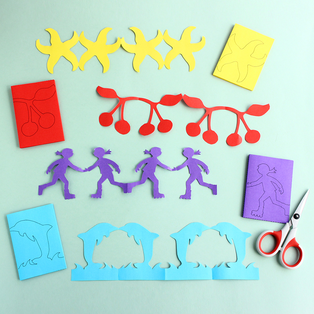 Ausgedruckte Bastelvorlagen und ausgeschnittene Papierketten Seestern, Kirsche, Mädchen, Delfin